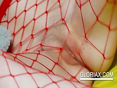 Teenis in fishnets playing with pussy