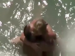 Nudist couple caught fucking in water