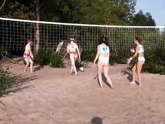 Voyeur films a group of young babes playing beach volleyball